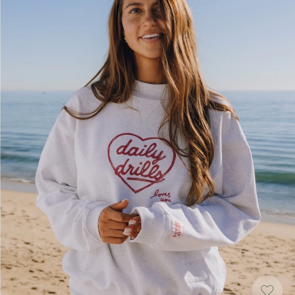 Daily Drills White Sweatshirt with Red Heart Design